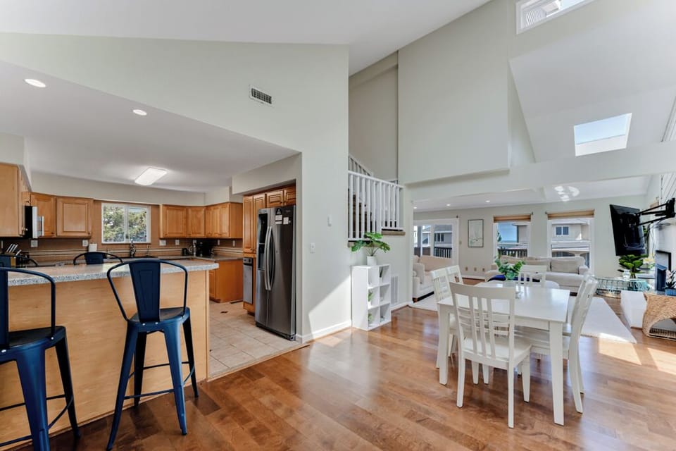Cook, connect, and dine in a welcoming open kitchen and dining area