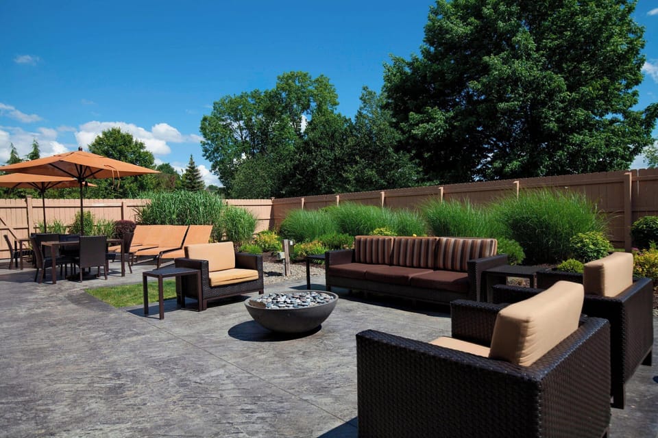 Unwind outdoors around the fire pit with cushioned lounge seating.