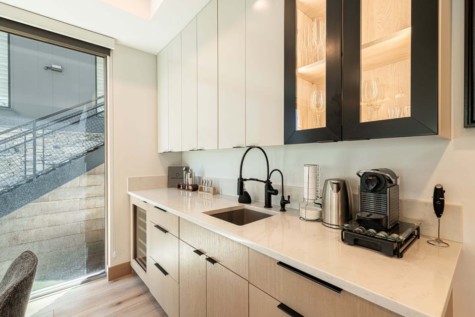 Bar area includes a Thermador undercounted wine refrigerator.