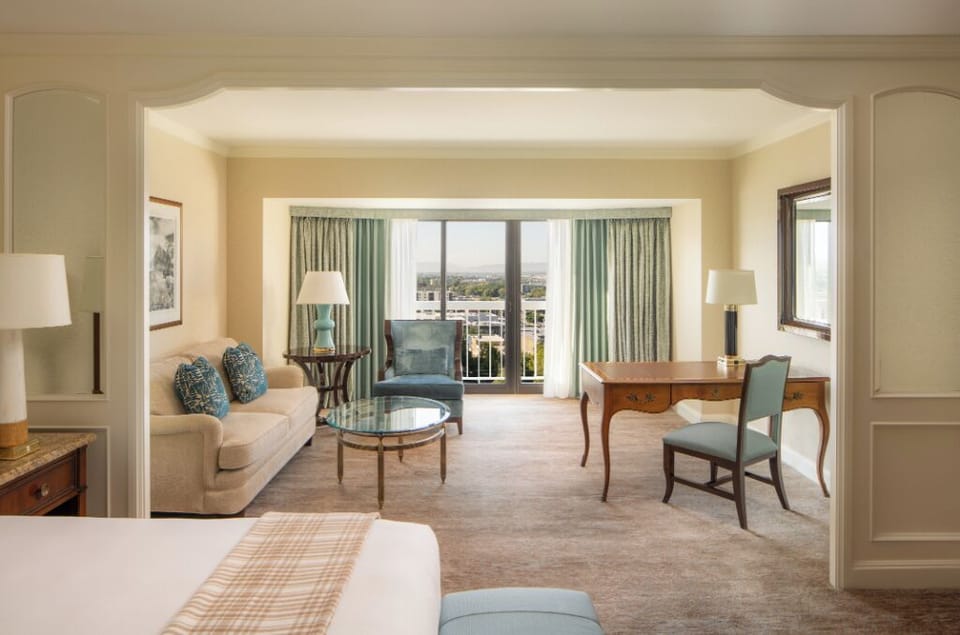 Unwind in a plush king bed with calming city views.