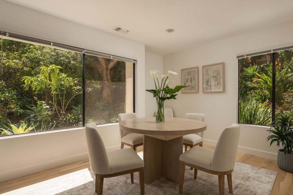 This round table opens to and oval to allow dinner for 8 guests.
