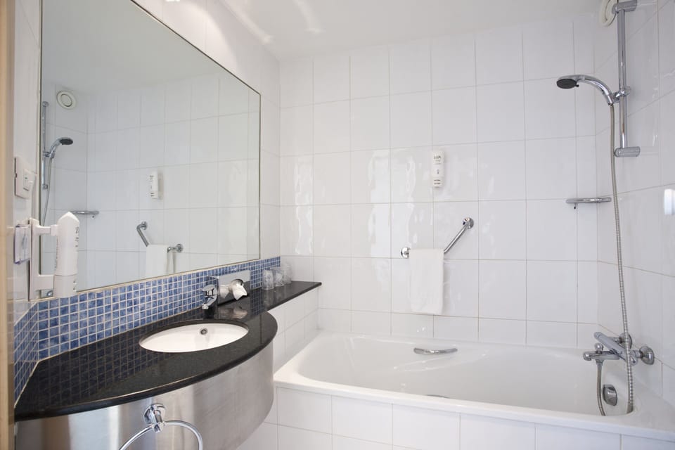 Bathtub, hair dryer, bidet, towels
