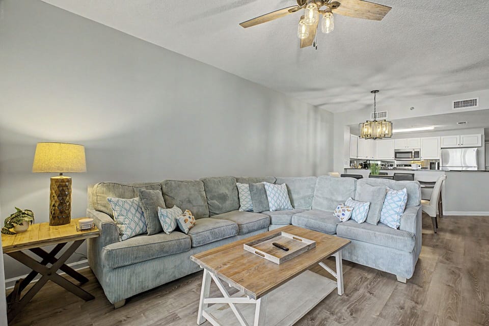 Bright, open living room with plenty of seating for the whole group