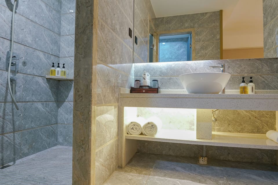 Superior Double Room | Bathroom | Rainfall showerhead, designer toiletries, hair dryer, bathrobes