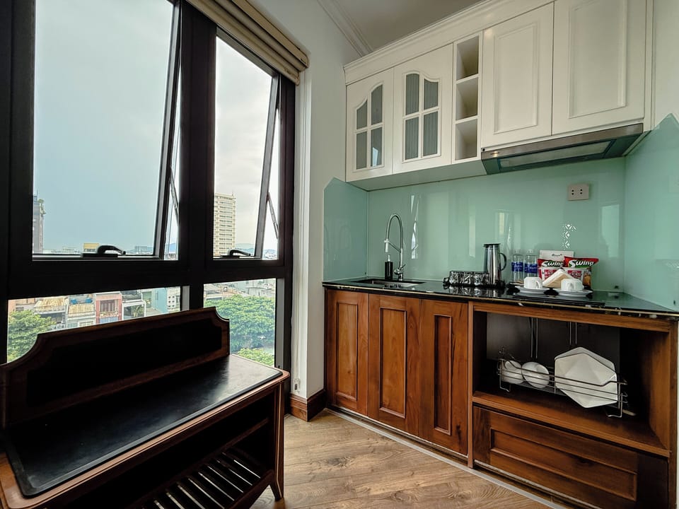 Premier Double Room, River View | Minibar, desk, laptop workspace, blackout drapes