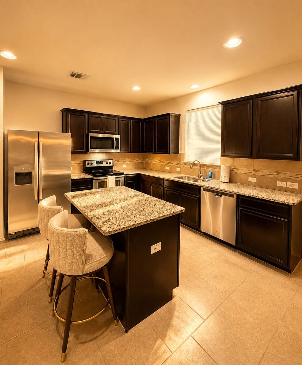 Modern Kitchen with Stainless Steel Appliances & an Island with seating
