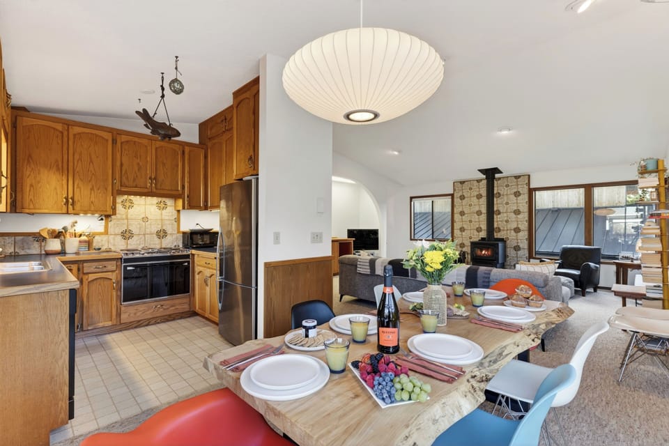 Functional kitchen with ample wood cabinetry and stainless steel appliances.