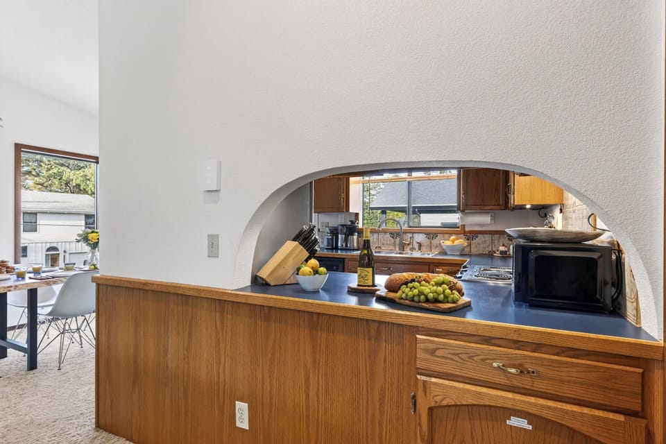 Looking through the kitchen pass-through window toward the living space.