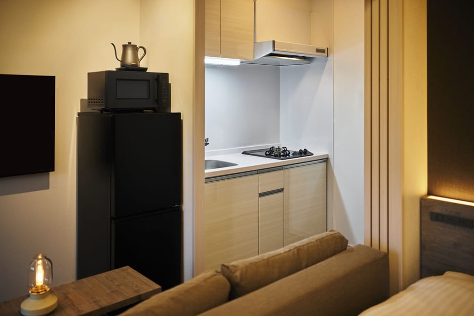 Double Room | Private kitchen | Full-size fridge, microwave, stovetop, cookware/dishes/utensils