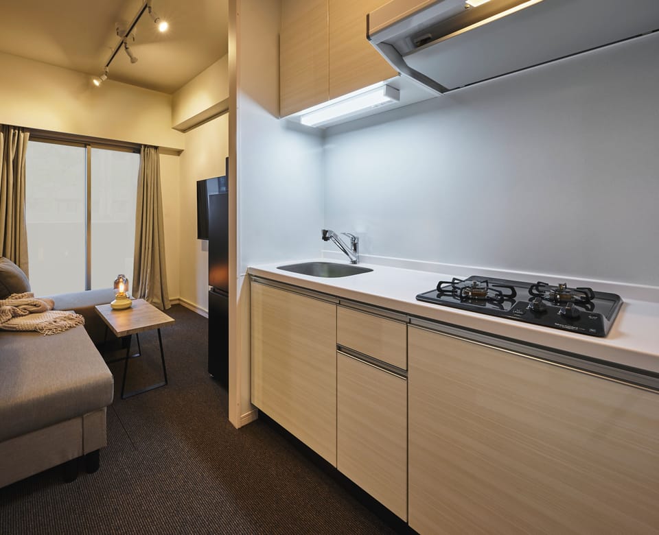 Double Room | Private kitchen | Full-size fridge, microwave, stovetop, cookware/dishes/utensils