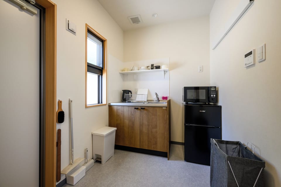 Apartment, Garden View | Private kitchen | Fridge, microwave, cookware/dishes/utensils