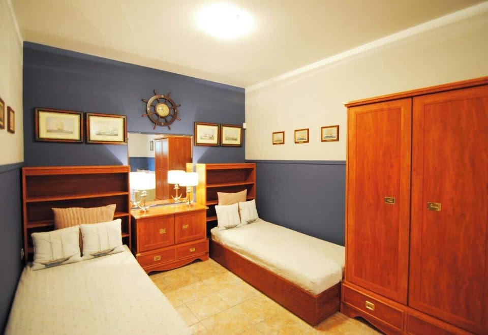 Spacious Bedroom with Double Bed and Wooden Wardrobe (Level 1)