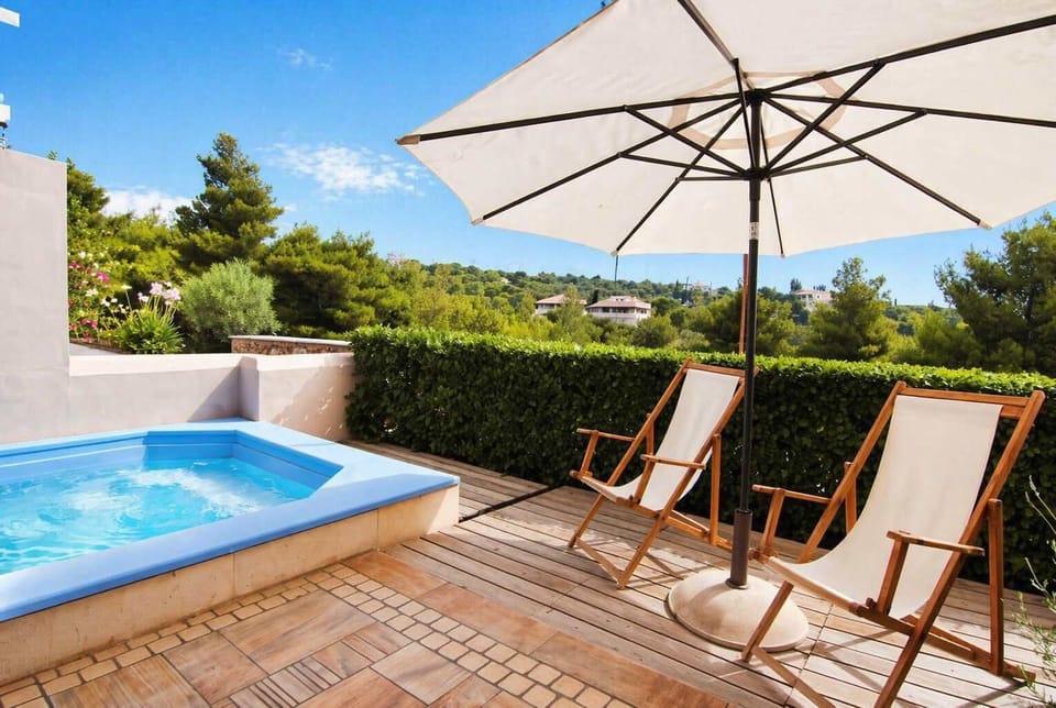Private Pool Area with Sunbeds and Umbrella on a Sunny East-Facing Terrace