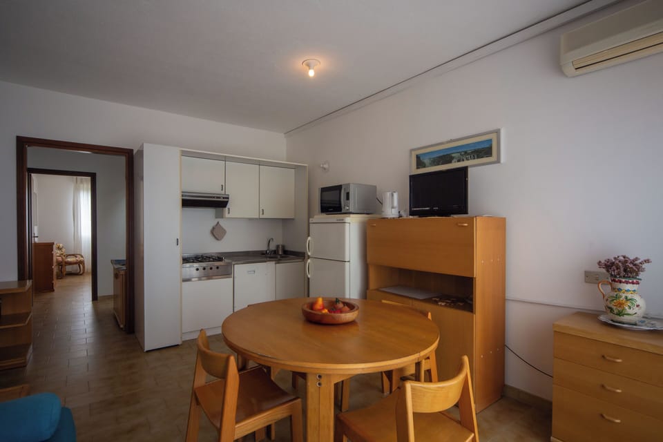 Apartment, Sea View | Living area | Flat-screen TV