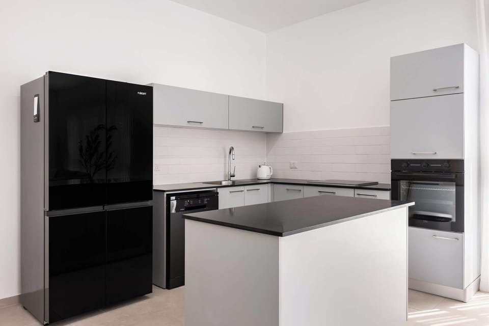 Modern appliances and ample workspace make cooking simple, whether preparing snacks or full dinners in.