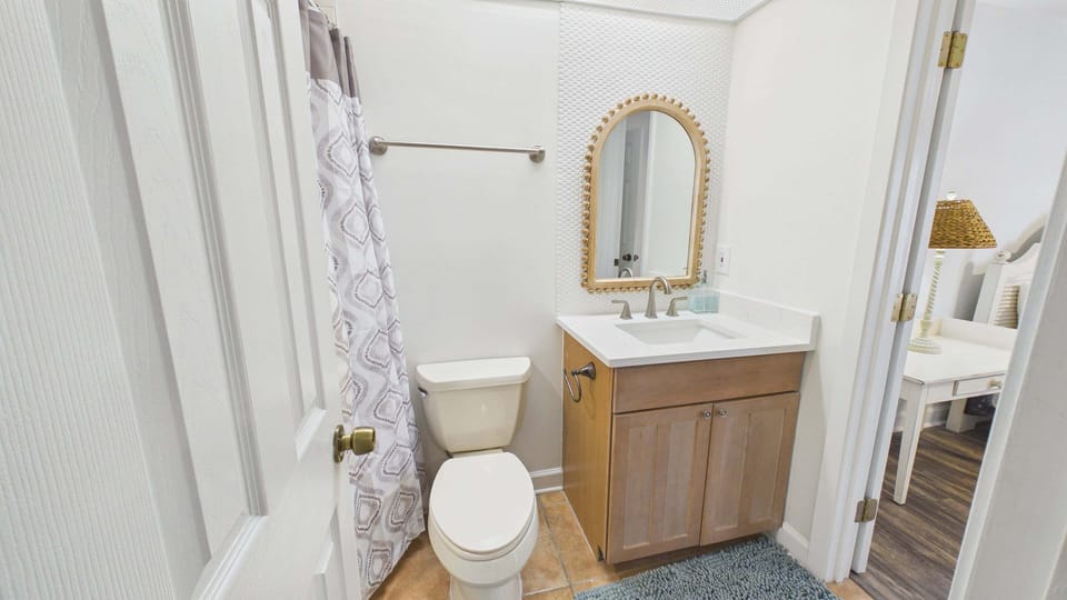 Guest bathroom with newly finished vanity and shower/tub combo