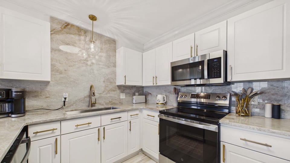 Full kitchen with all the cooking essentials and breakfast bar seating options