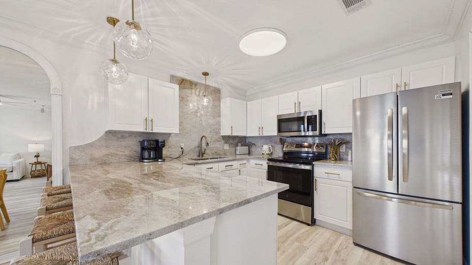 Full kitchen with all the cooking essentials and breakfast bar seating options