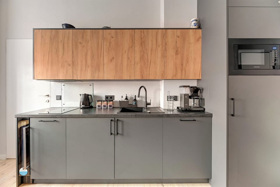 Deluxe Apartment, Kitchenette, Courtyard View | Private kitchen | Toaster, highchair, freezer, paper towels
