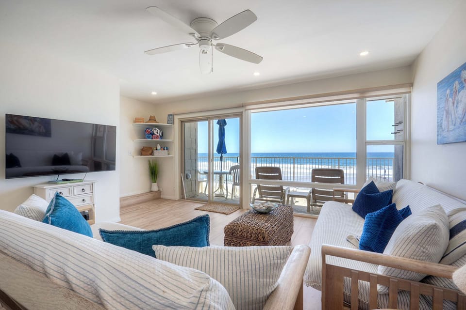 Comfortable seating facing oceanfront patio on the lower level.