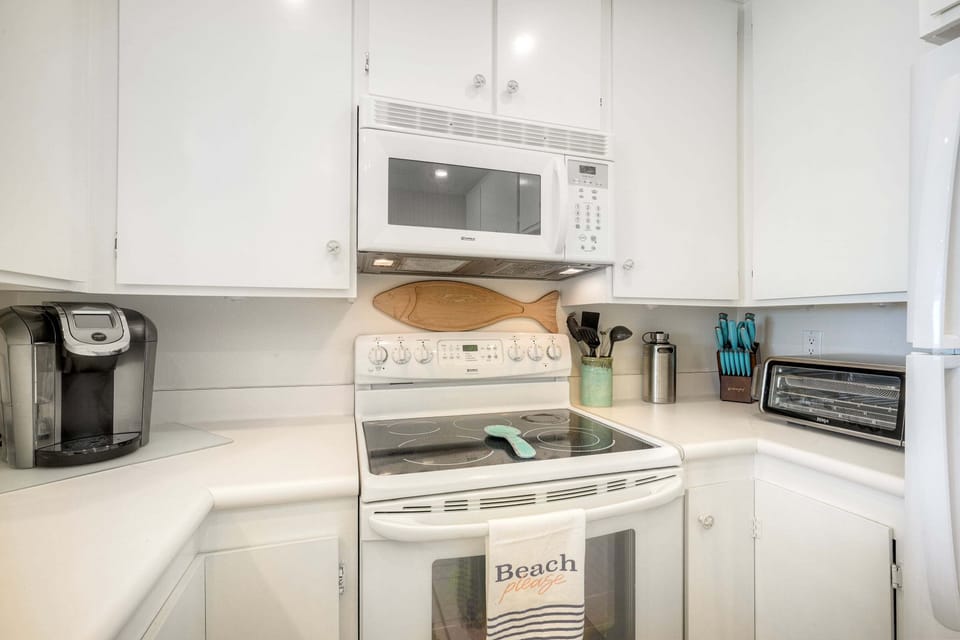 Clean appliances with modern finishes.