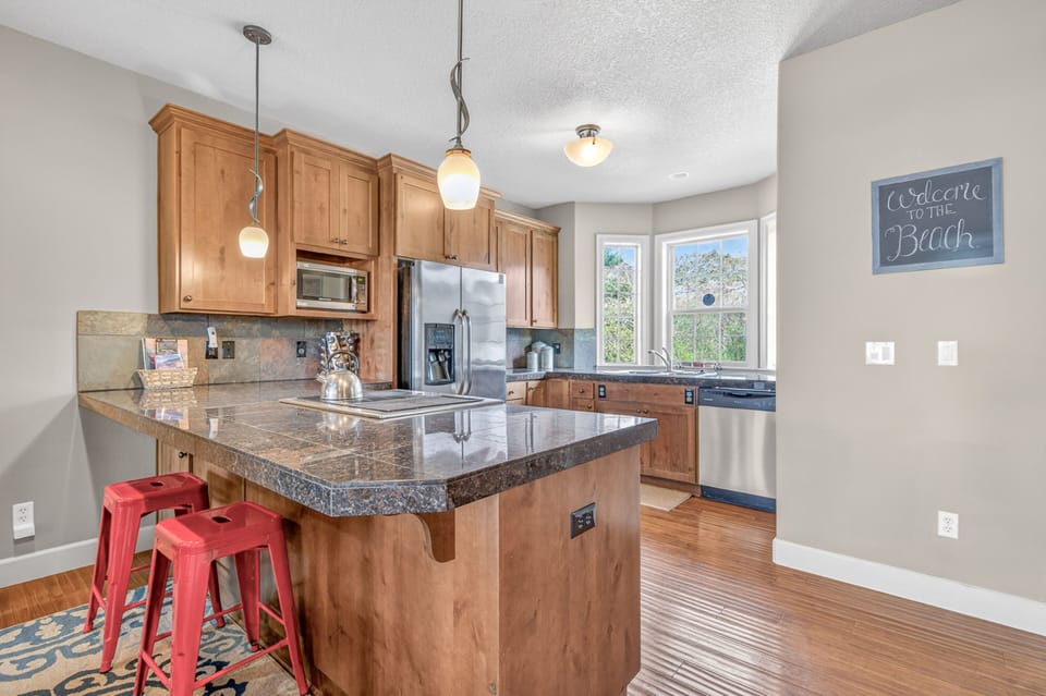 Your gourmet kitchen features granite counters and modern appliances, perfect for creating memorable meals together.