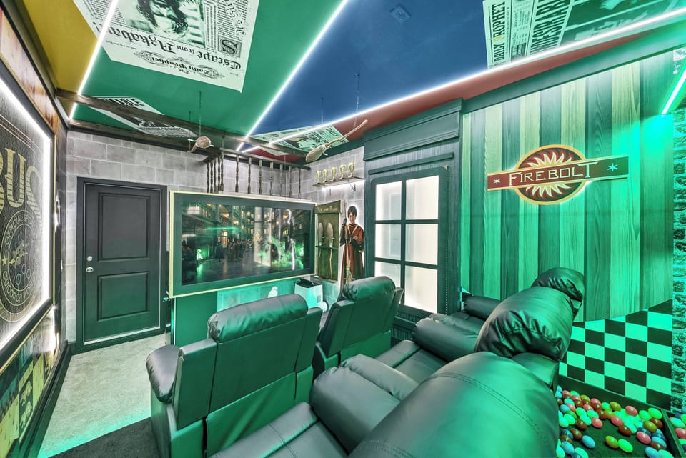 Step into a vibrant entertainment room highlighted by striking green lighting and retro decor that sets a fun atmosphere. The plush leather seating invites relaxation as you take in the cinematic experience on the large screen.