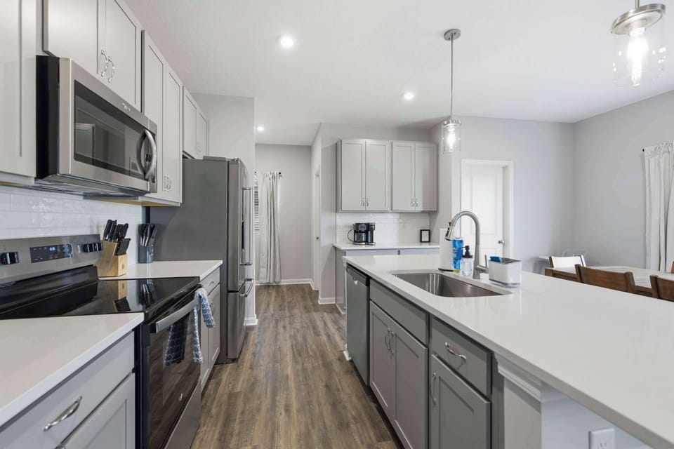 The open kitchen offers ample space & all the comforts of home​