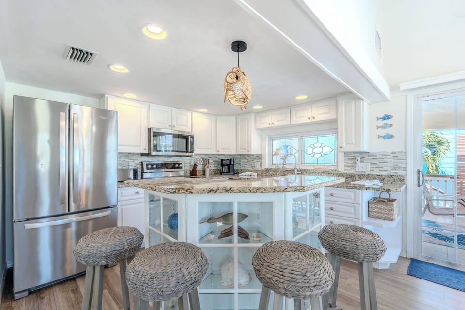 Gather around the breakfast bar and enjoy a meal together.