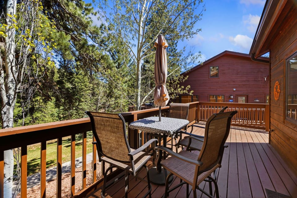 Step onto your private deck where morning coffee tastes better surrounded by towering trees and peaceful mountain air.