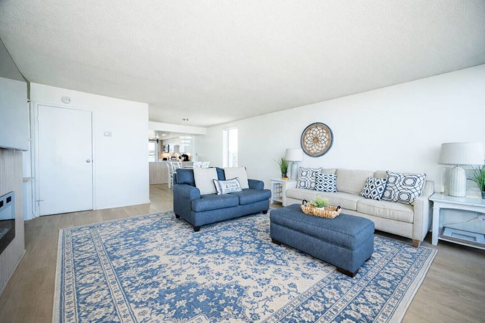 Bright, open layout connecting living room and kitchen—ideal for gathering, relaxing, and entertaining.