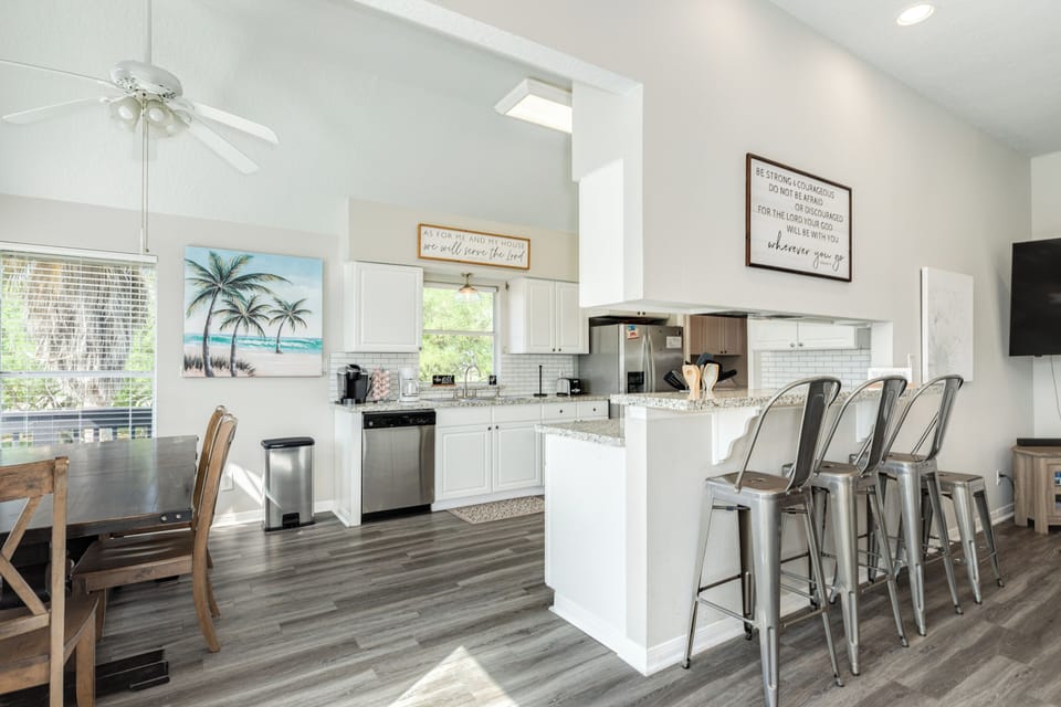 The living area opens directly to the adjacent dining and kitchen spaces