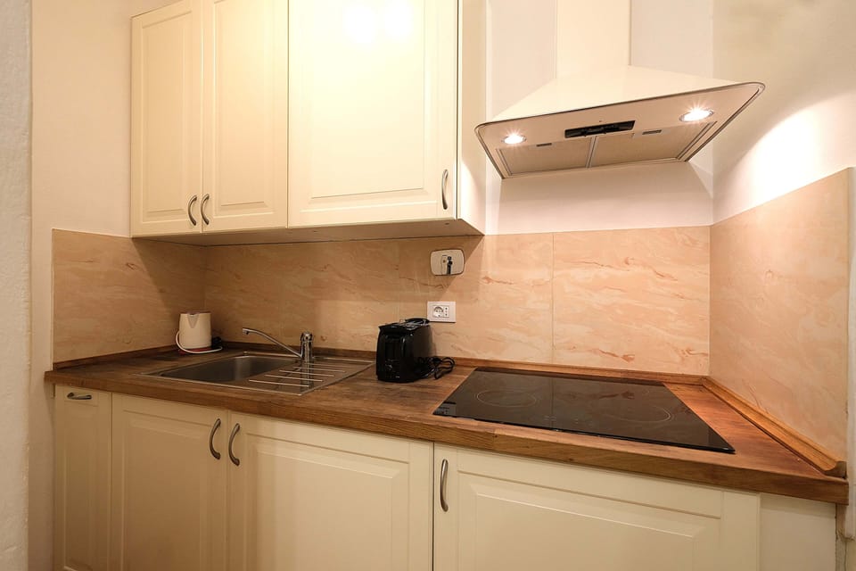 Comfort Apartment, City View | Living area | 80-inch flat-screen TV with digital channels
