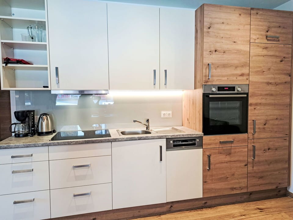 Cabinetry, Countertop, Flooring, Kitchen Appliance, Furniture, Kitchen, Wood, Interior Design, Major Appliance, Cupboard