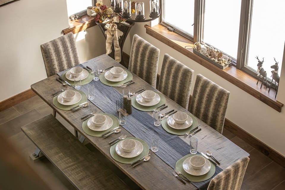 Gather around this beautifully set dining table where memorable meals await your family and friends.