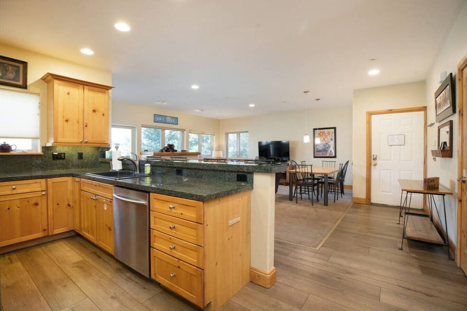 Open concept kitchen with bar seating, dining table and fully stocked with everything you need!