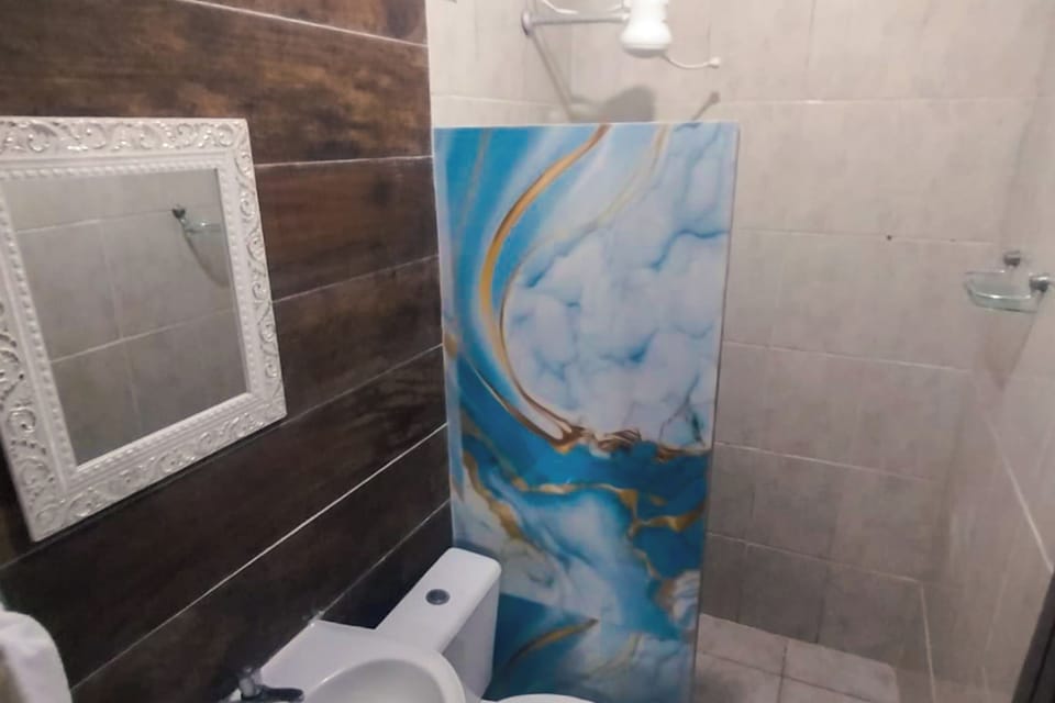 Economy Room | Bathroom | Shower, free toiletries, towels, toilet paper