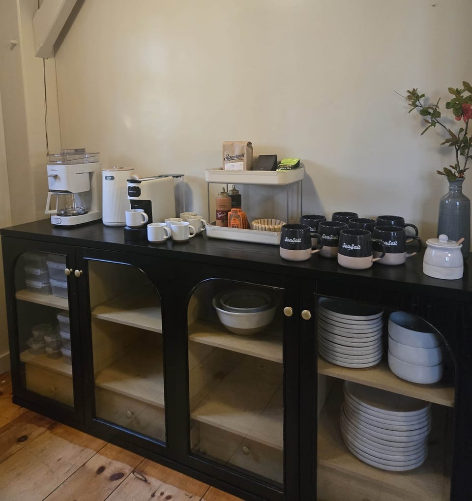 Fully stocked coffee + tea bar in the walk-in pantry