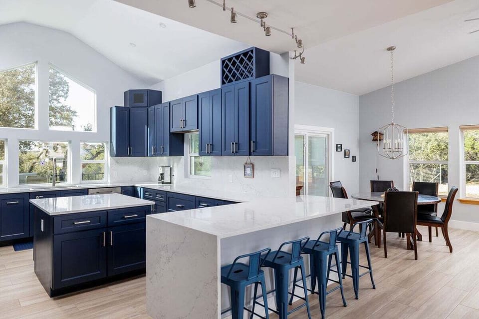 Spacious island and breakfast bar set the stage for morning conversations over coffee or evening socials with a glass of local wine.