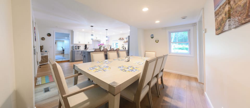Spacious dining for 8 with open kitchen and bright, modern style