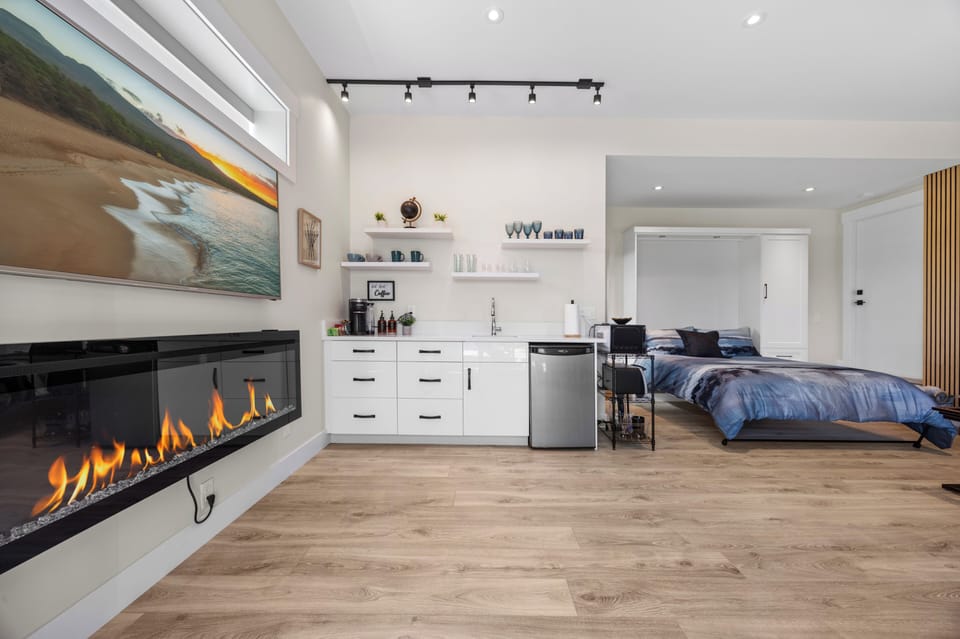 T.V. Fireplace and a cute kitchenette in your open concept guest suite.