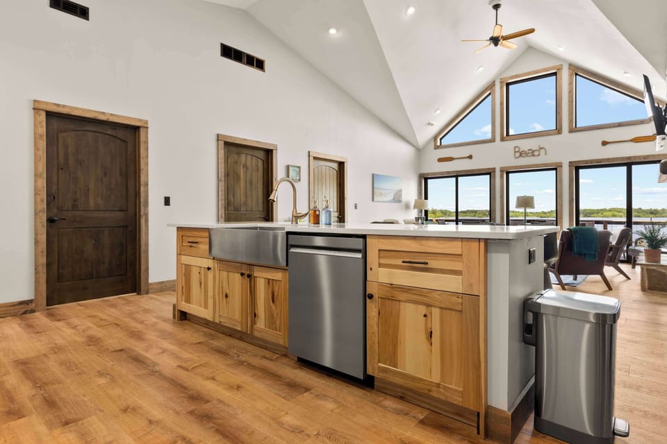 Island in the kitchen featuring ample counter space and stool seating for a convenient breakfast bar area.