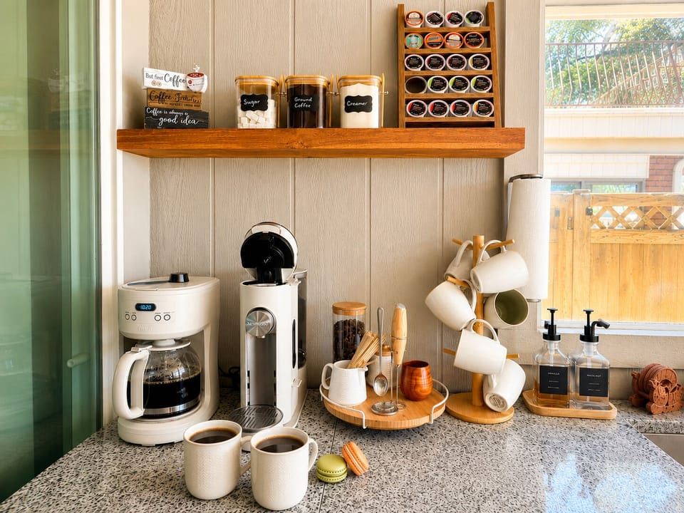 Kick-start your day with coffee from our curated coffee bar in the sunroom, then step outside to enjoy the lovely views. Coffee Bar 1_1