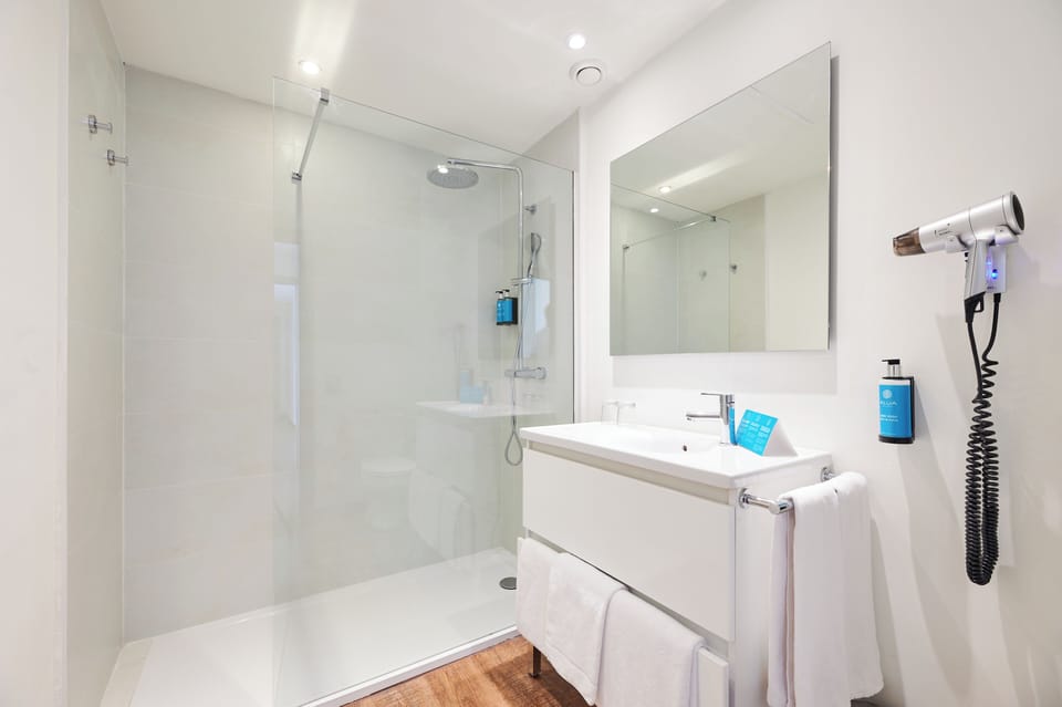 Hair dryer, towels, soap, shampoo