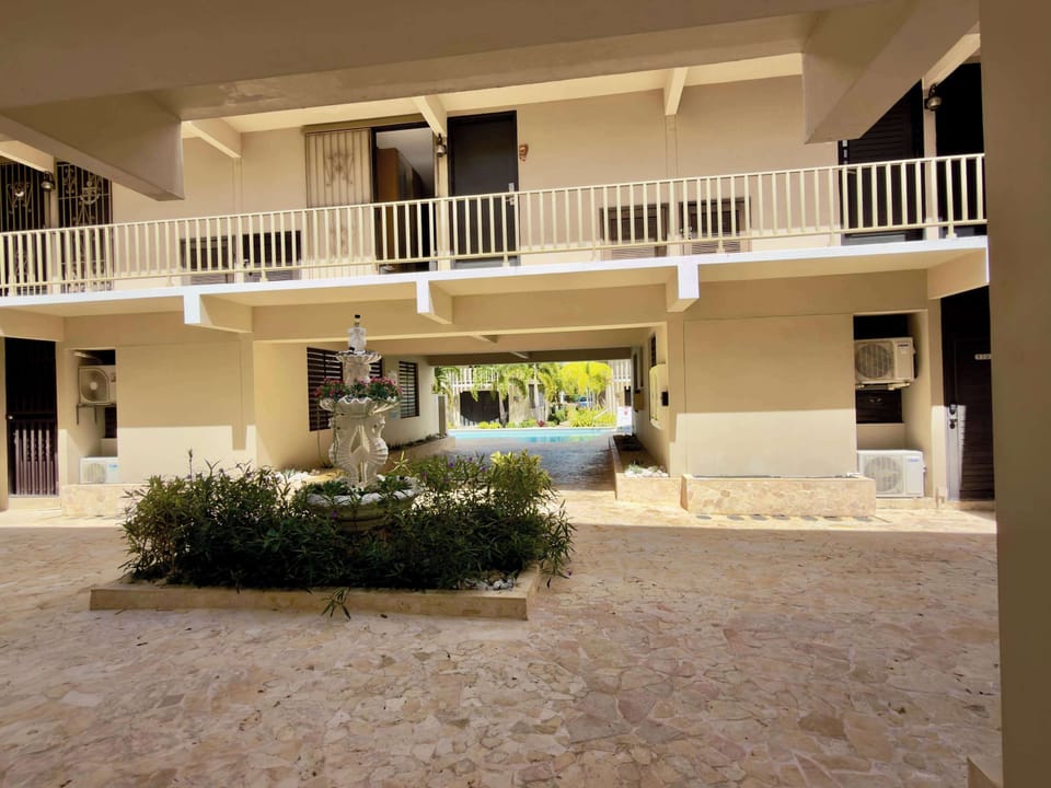 Charming two-story building nestled in Villa Taina resort complex.