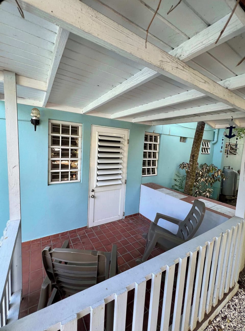 Private patio with outdoor dining table and chairs, ideal for al fresco meals
