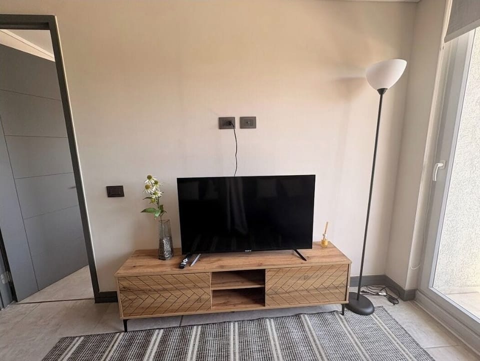 Standard Apartment, 1 Bedroom | Living area | 40-inch LED TV with digital channels