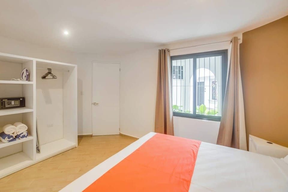 Bedroom: King bed, security box, air conditioning, iron, hair dryer, closet