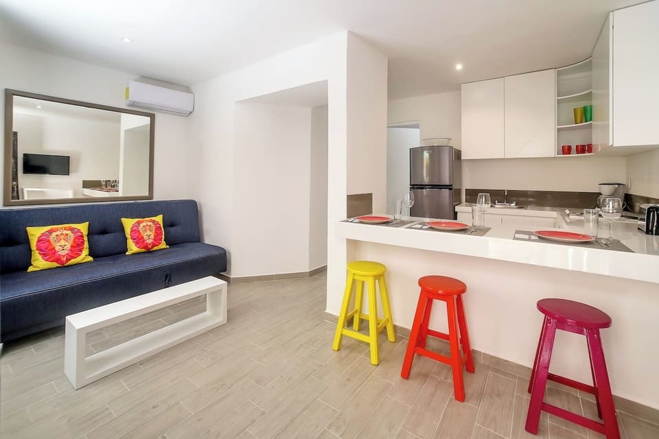 Living room, kitchen and dining. Sofa folds flat for an extra sleeping space 