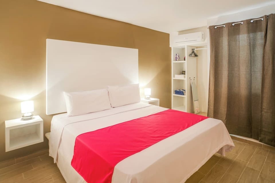 King bed, hair dryer, iron and security box in the bedroom